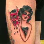 A solid tattoo of a girl rockin' a demon mask, tattoo by Anem. #Anem #traditionaltattoo #girl #girltattoo #demon #traditional #traditionalgirl