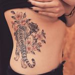Tiger tattoo by Grain. #Grain #TattooistGrain #fineline #animals #tiger #flora #fauna #flowers #feline