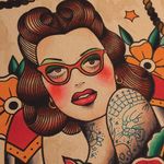 A lovely piece of flash art by Howlin' Wolf (IG—howlinwolftattoo) featuring a lady wearing reading glasses. #glasses #flashart #ladyhead #HowlinWolf #traditional
