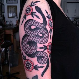 Surreal snake with some blossoms. Rad tattoo by El Carlo. #ElCarlo #ElCarloTattoos #boldtattoos #surreal #snake #blossoms
