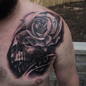 Black and grey skull and rose tattoo by JP Alfonso. #blackandgrey #realism #JPAlfonso #skull #rose