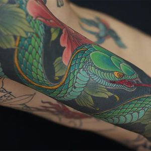 One hell of a hebi by Artemy Neumoin (IG—ishpiricatattoo). #ArtemyNeumoin #Japanese #sleeve #snake #traditional