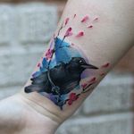 Watercolor brushstroke bird and cherry blossom tattoo by Georgia Grey. #illustrative #sketchy #watercolor #GeorgiaGrey #bird #flower #cherryblossom