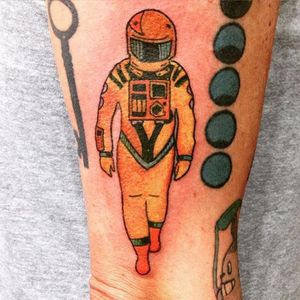 Classic yellow space suit in 2001: A Space Odyssey in a traditional design by Aline Torchia #AlineTorchia #StanleyKubricktattoos #2001ASpaceOdyssey #filmtattoo #movie
