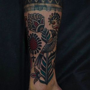 Solid looking leg tattoo of a flower by Or Kantor. #OrKantor #flower #traditional
