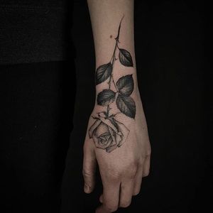 Rose tattoo by Ed Taemets. #rose #blackandgrey #longstemmedrose #EdTaemets