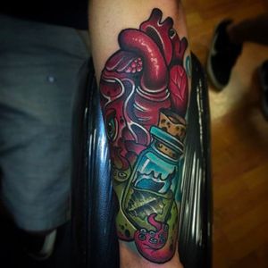 Rad looking octopus and hear morph tattoo holding a jar with a sea shell. Cool tattoo by Shane Klos. #shaneklos #neotraditional #illustrative #revolutioninkstudio #octopus #heart #jar #seashell