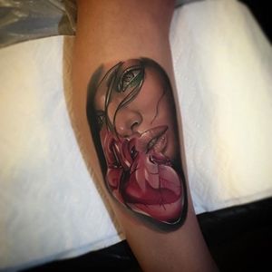 Woman and heart surrealism piece by Poch Tattoos. #realism #colorrealism #PochTattoos #surrealism #heart #woman #face