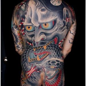 Killer back-piece featuring hannya devouring a vicious snake.