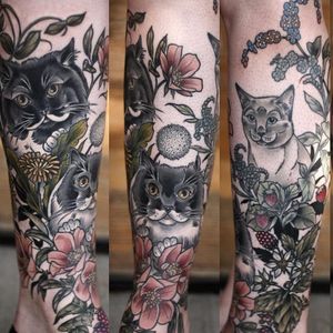An adorable feline sleeve by Kirsten Holliday. #KirstenHolliday #Nature #NatureTattoo #cat #cattattoo #floral #flowers