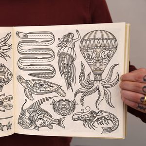 Some of the weird mashups in The Tattoo Flash Coloring Book by Ollie Munden. #bookreview #coloringbook #flashdesign #MEGAMUNDEN #OllieMunden