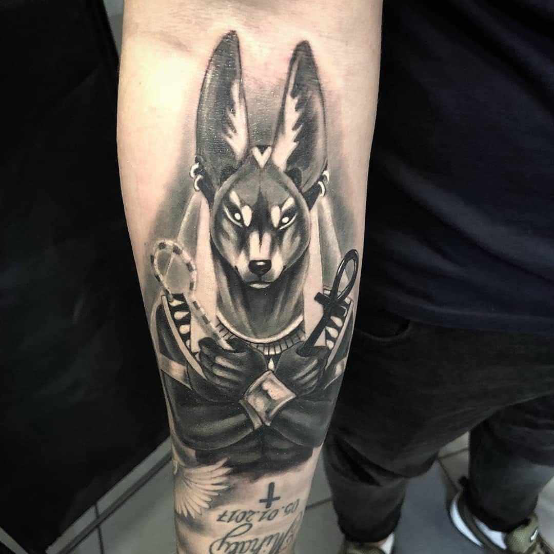 Dog god tattoo
