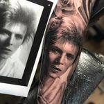 Bowie tattoo by Teneile Napoli #TeneileNapoli #musictattoos #blackandgrey #realism #realistic #hyperrealism #portrait #DavidBowie #music #singer #glam #lips #eyes #tattoooftheday