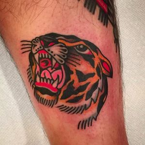 Another funky and bold looking tiger head tattoo by Jason Ochoa. #JasonOchoa #GreenPointTattooCo #traditionaltattoo #boldtattoos #tiger #head