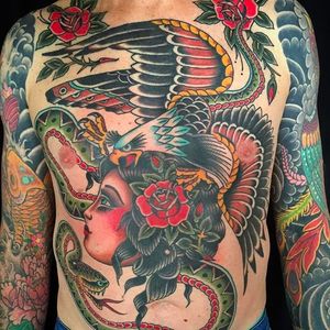 Insane looking front tattoo done by Andrew Mcleod. #AndrewMcleod #traditionaltattoo #snake #girl #eagle