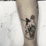 Blackwork man fishing in a broken bottle tattoo by Benjamin Fly. #BenjaminFly #blackwork #conceptual #fishing #bottle