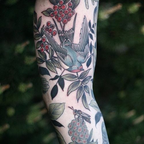 Enchanting neo-traditional sleeve of nature-inspired imagery by Kirsten Holliday that harkens to biological illustration. #bee #KirstenHolliday #honeyblossom #mistletoe #neotraditional #sleeve #swallow