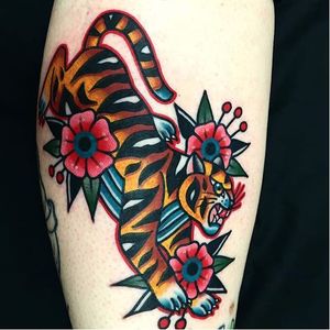 Dani Queipo channels the spirit of Shere Khan in this traditional piece. #bold #cats #cattoos #DaniQueipo #traditional #tiger
