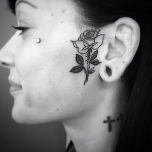 Rose tattoo by Abes #Abes #blackwork #rose #facetattoo #flower