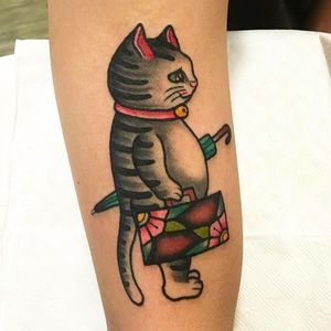 Cute little cat tattoo! Awesome work by Ginger Jeong. #gingerjeong #cat #traditional #neotraditional #coloredtattoo #blossom #umbrella