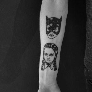 Catwoman and Wednesday Addams blackwork hand poke portrait tattoo by Maks Mariańczuk. #MaksMarianczuk #BlameMax #handpoke #blackwork #sticknpoke #portrait #popculture #icon #wednesdayaddams #addams #addamsfamily #batman #catwoman