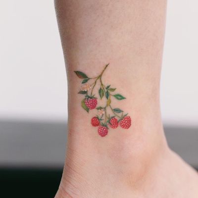 Raspberry sweetie. Tattoo by Saegeemtattoo #Saegeemtattoo #cutetattoos #color #fruit #raspberry #foodtattoos #nature #leaves #branch #flowers
