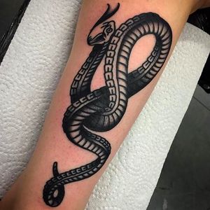 Insane and solid black snake tattoo by Rodrigo Garcia Delgadillo. #RodrigoGarciaDelgadillo #snake #blacktraditional