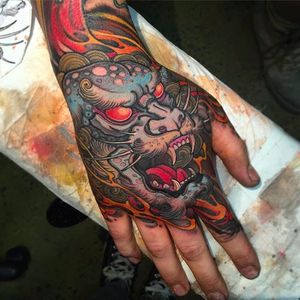 Foo Dog head on hand, tattoo by Matty D. Mooney. #handtattoo #foodog #japanese #mattydmooney