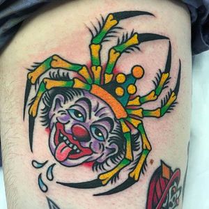 Spider clown head morph tattoo by Fergus Simms. #FergusSimms #MelbourneTattooCompany #traditionaltattoo #boldtattoos #clown #spider
