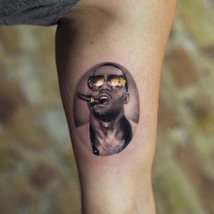 Kanya West tattoo by Jefree Naderali #jefreenaderali #musictattoos #KanyeWest #portrait #realism #realistic #hyperrealism #rapper #music #sunglasses #cigar #gangsta #bling #money #fame #tattoooftheday