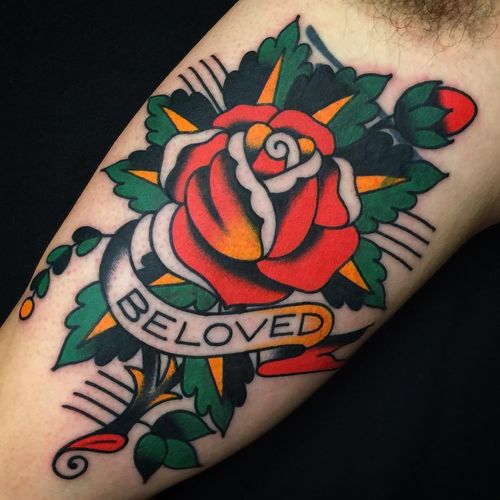 Super clean cover up tattoo by Josh Bovender #JoshBovender #flowertattoos #traditional #color #rose #rosebud #flower #floral #banner #text #quote #beloved #love #leaves #nature