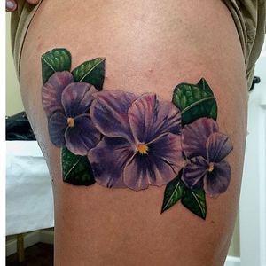 Triple violet thigh piece by Tommy Giblin. #violet #flower #purple #realism #styledrealism #TommyGiblin