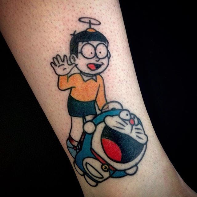 Doraemon tattoo on Ibai Llanos shin