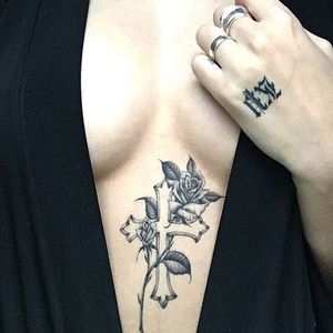 Kane Trubenbacher (IG—kanetrubenbacher) religious tattoos are immaculate. #blackandgrey #cross #delicate #KaneTrubenbacher #small #roses