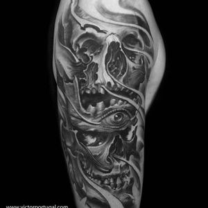 The fusion of horror imagery here is exemplary of Victor Portugal's unique black and grey work. #arm #bioorganic #blackandgrey #eyeball #horror #hyperrealism #VictorPortugal #realism #skulls