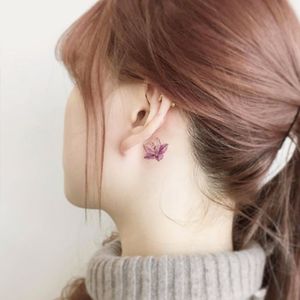 Sweet delicate lilly tattoo behind the ear #delicate #flower #lilly #behindtheear #purple #watercolor