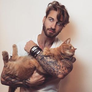 A man's best friend. #TravisDeslaurier #tattoomodel #cat