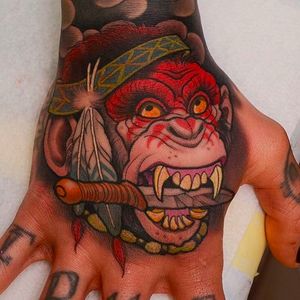 Super cool war chimp hand tattoo by Peter Lagergren. #neotraditional #peterlagergren #neotraditional #handtattoo #PeterLagergren