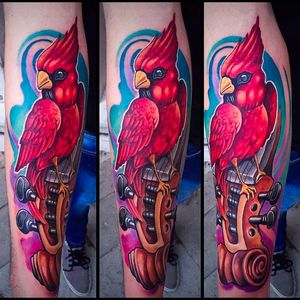 Superb tattoo execution on this cardinal tattoo by Andrea Lanzi. #andrealanzi #cardinal #newschool #Violin #parrot