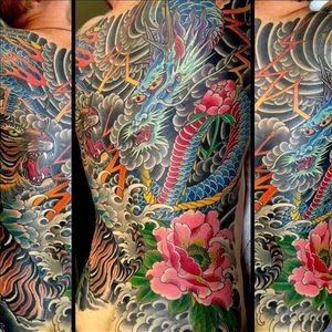The level of color, complexity, and contrast in Rubendall's work is simply astounding. #backpiece #color #detail #dragon #Japanese #MikeRubendall #peony #tiger #thunderstorm #waves