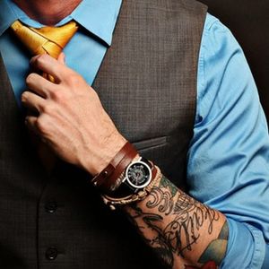 Visible tattoos aren't seen as the stigma that they once were. #HandTattoo #WorkplaceTattoo #TattoosAtWork