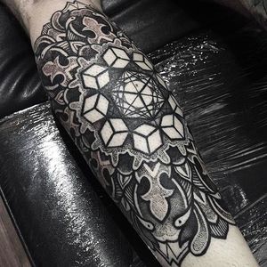 Intense detail work on this forearm tattoo done by Paul Davies. Check out the dot work and clean lines! #pauldavies #blacktattoo #illustrativetattoo #geometrictattoo #dotstolines