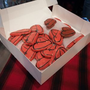 A box of delicious looking Stormy Kromer cap cookies. #caps #DanPemble #HatsforLife #SacredTattooStudio #StormyKromer