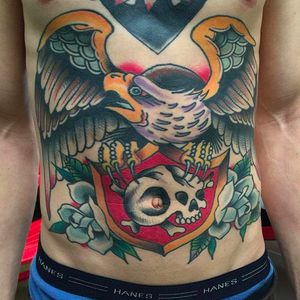 Solid eagle tattoo in stomach by Billy White. Photo: @billywhitetattoos #eagle #traditional #fronttattoo #stomachtattoo