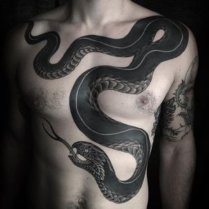 Slithering snake by Zac Scheinbaum #ZacScheinbaum #darkarttattoos #blackfill #blackandgrey #snake #chestpiece #reptile #animal #nature #scales #fangs #tattoooftheday
