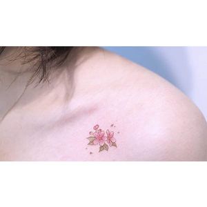 Floral micro tattoo by Baam. #Baam #TattooerBaam #subtle #microtattoo #southkorean #fineline #tiny #flower #floral