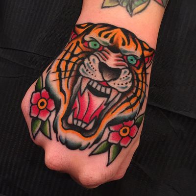 Tiger tattoo by Samuele Briganti #samuelebriganti #color #traditional #tiger #junglecat #cat #flowers #leaves #nature #fangs #tattoooftheday