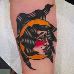 Crescent moon girl head tattoo looking vibrant and solid. Amazing work by Mark Cross. #MarkCross #rosetattooNYC #TraditionalTattoo #BoldTattoos #girlhead #crescent