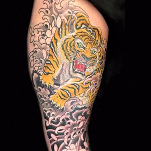 Tiger making waves by Henning Jorgensen #HenningJorgensen #Japanese #color #blackandgrey #tiger #waves #cherryblossoms #flowers #animal #junglecat #ocean #tattoooftheday