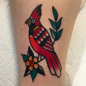 Cute and solid little red cardinal tattoo by Joshua Marks. #JoshuaMarks #ETS #traditionaltattoos #boldtattoos #classic